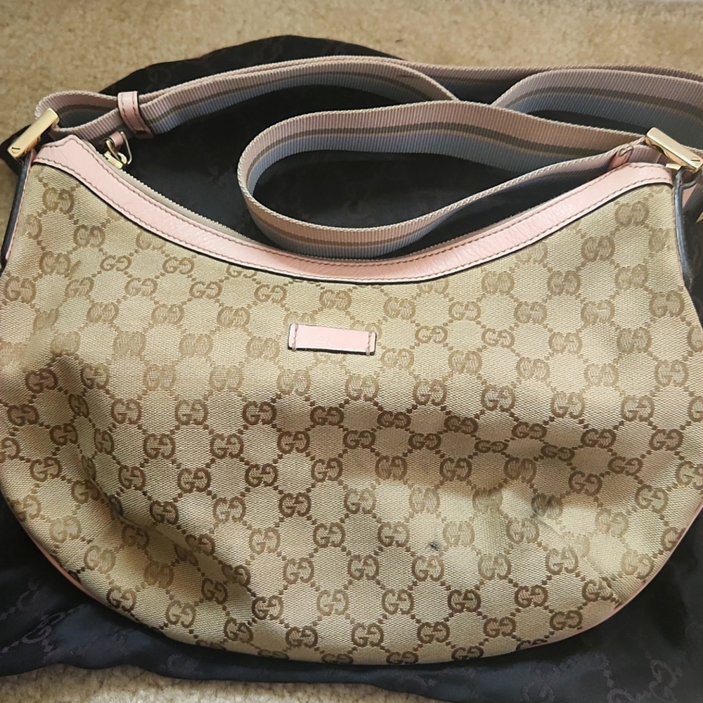 Gucci shoulder bag with long adjusted light pink and blue strap.